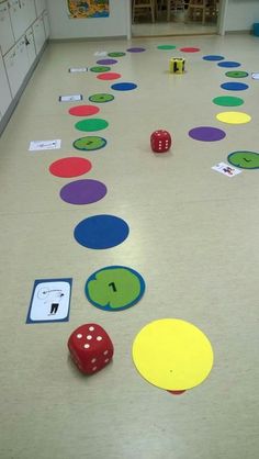 a room with many different colored circles and dices on the floor next to each other