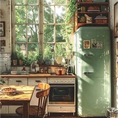 an old fashioned kitchen with a green refrigerator and table in the middle, surrounded by windows