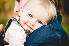 a woman holding a baby in her arms