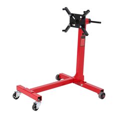 a red dolly with two wheels on the top and one wheel attached to it's base