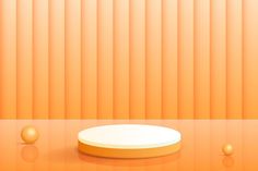 an orange room with a white round object on the floor and three balls around it