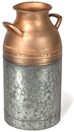 an old fashioned copper and silver metal container