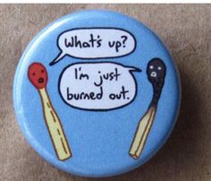 a blue button with two spoons and a speech bubble saying what's up i'm just burned out