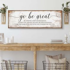 a wooden sign that says go be great on the wall above a table with baskets