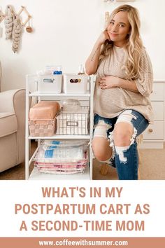 a woman sitting on top of a white cart next to a wall with pictures and text that reads, what's in my postpartum cart as a second - time mom