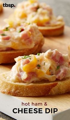 some food is laying out on a cutting board with the words hot ham and cheese dip