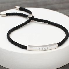 ** Black currently out of stock Stylish men's sterling silver and cord friendship bracelet personalised with a message for the lucky recipient to create a very special bespoke gift Gender neutral Stylish and unusual, this bracelet is made from sterling silver and hard wearing silk cord Available in a choice of blue or black silk cord. Your special words make this a perfect present for birthdays or to mark a special date and will be treasured forever. It is stylish, simple and easy to wear with a Sterling Silver Adjustable Friendship Bracelets, Sterling Silver Friendship Bracelet With Sliding Knot, Everyday Adjustable Sterling Silver Friendship Bracelets, Personalized Silver Braided Minimalist Bracelet, Personalized Silver Minimalist Friendship Bracelets, Personalized Silver Braided Bracelet Minimalist Style, Personalized Minimalist Silver Friendship Bracelet, Modern Sterling Silver Braided Bracelet Gift, Minimalist Sterling Silver Friendship Bracelets