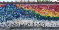 there is a wall made out of bottle caps