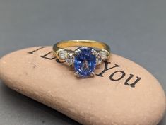 A classic in style and luxury, combining the perfect combination of blue and gold! Made in dual-tone 19K yellow and white gold, our engagement ring is set with a massive 2.5Ct oval natural sapphire, with a vivid blue color and strong brilliance! On each side of the sapphire are two 4x3mm oval natural diamonds, along with 6 natural diamonds baguettes. The oval diamonds have a combined weight of 0.3Ct, with average color G, clarity VS2. The baguettes have similar qualities, with a combined weight of 0.2Ct. Please be aware that the ring size is 7, but we can adjust it for free before shipping! Please let us know your ring size beforehand! the ring weighs 4dwt, or 6.4 grams. The combined weight of all stones is 3ct. Details:  Metal: 18K Solid Yellow & White Gold Central Stone: 9x6.5mm Deep Blu Gia Certified Oval Yellow Gold Wedding Ring, Gia Certified Oval Gold Sapphire Ring, Gia Certified Gold Sapphire Ring, Gold Oval Rings For Wedding Proposal, Oval Gold Ring With Accent Stones For Wedding, Oval Gold Ring With Accent Stones, Yellow Gold Sapphire Ring With Brilliant Cut For Proposal, Gold Oval Sapphire Ring With Brilliant Cut, Classic Gold Sapphire Ring For Proposal