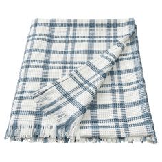 a blue and white plaid blanket with fringes