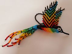 a multicolored bird made out of beads