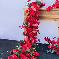 red flowers are arranged in the shape of a letter