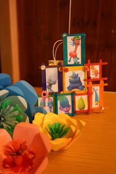 colorful paper flowers and cards on a table