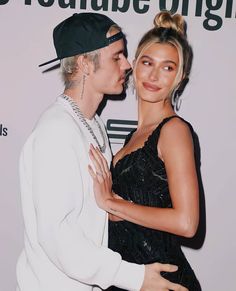 a man and woman standing next to each other