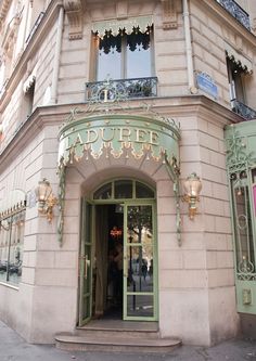 the entrance to an old fashion store in paris