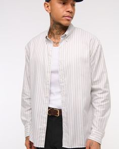 Classic oxford button-up shirt in a stretchy 100% cotton fabric, featuring 2-way stretch with straight hem and button-down collar. Casual Cotton Button-up Dress Shirt, Cotton Button-up Dress Shirt For Fall, Fall Cotton Button-up Dress Shirt, Cotton Button-up Dress Shirt With Placket, Casual Striped Button-up Dress Shirt, Cotton Dress Shirt With Button Closure For Fall, Casual Unstructured Dress Shirt, Casual Long Sleeve Dress Shirt For Everyday, Casual Fitted Dress Shirt For Everyday