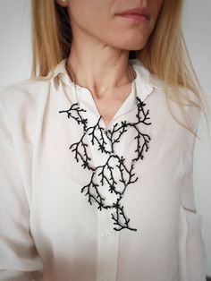 I have spent many days before designing this piece. But I think it was worth the effort. :-) This is a reinterpretation of my silver twig necklace. I connected multiple twig branches into cascading shape, ever so versatile to wear it with a simple T-shirt, dress, or cool leather jacket. I have painted each twig with black acrylic paint and rubbed it with sand paper, so it has a more interesting look ( it has small silver touches of color underneath).  I used stainless steel jump rings and stainl Unique Black Bib Necklace As A Gift, Forest Jewelry, Cascade Necklace, Wearable Art Clothing, Branch Necklace, Contemporary Jewelry Design, Wearable Art Jewelry, Necklace Big, Stainless Steel Chain Necklace