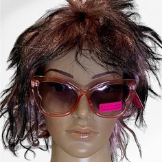 a mannequin head wearing sunglasses with pink stickers on it