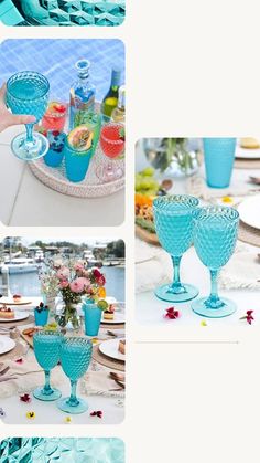 blue glassware is sitting on a table with plates and flowers in it, along with other dishes