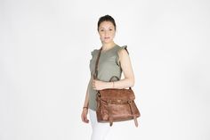 "Brown leather satchel made from 100% Genuine Italian cowhide distressed leather Finally a women's messenger bag that imparts femininity , made from soft leather and designed with a classy and sophisticated way.Designed for working women and students that need to carry paperwork , laptop , chargers etc in a stylish handbag. F E A T U R E S --- EXTERIOR ---- -Available in 2 sizes for a 15\" laptop or a 13\" laptop size ( choose from the dropdown menu ) -Adjustable / detachable cross body shoulder Stylish Laptop Bag, Brown Leather Messenger Bag, Laptop Size, Messenger Bag Leather, Womens Messenger Bag, Brown Satchel, Brown Leather Satchel, Working Women, Vintage Leather Bag