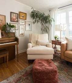 a living room filled with furniture and a piano