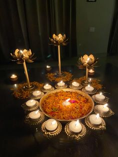 an elaborately decorated dish with candles on the table