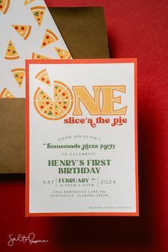 a pizza themed birthday party is set up on a red table with brown envelopes