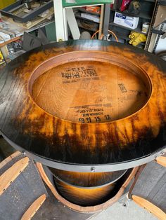 a large wooden barrel sitting on top of a table