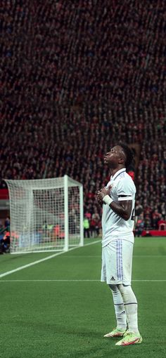 a man standing on top of a soccer field