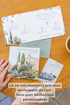 a table topped with cards and envelopes next to a cup of coffee