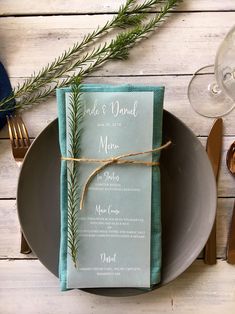 a place setting with napkins and silverware