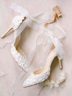 wedding shoes and flowers on a pink background