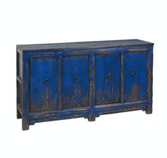 an old blue cabinet with three doors and two drawers on one side, against a white background