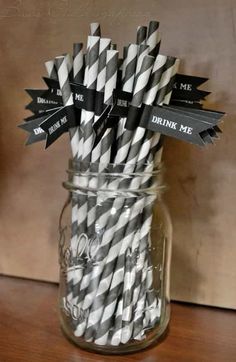 black and white striped paper straws in a mason jar