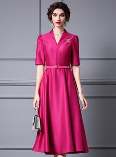 Fusing classic elegance with contemporary style, this fuchsia dress is designed to impress at any event. The dress features a beautifully tailored fit that highlights your curves, with a fitted bodice and a flared skirt that adds a touch of femininity. The deep V-neckline and structured collar create a sophisticated look, while the elbow-length sleeves provide a refined and polished appearance. The dress is accented with a matching belt that cinches the waist, enhancing your silhouette and addin Elegant Pink Short Sleeve V-neck Dress, Elegant Pink V-neck Puff Sleeve Dress, Elegant Red Short Sleeve V-neck Dress, Elegant V-neck Midi Dress With Box Pleat, Elegant Pink V-neck Shirt Dress, Fuchsia Dress, Satin Short, Dress Stores Online, Fuchsia Color