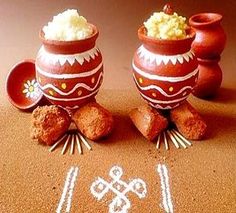 three clay pots with food in them sitting on the ground