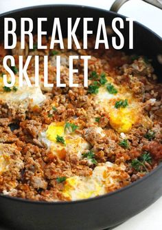 a skillet filled with eggs and meat