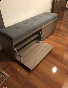 a bench that is sitting on top of a hard wood floor