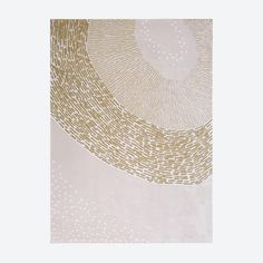 a beige and gold rug with circles on it