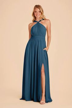 a woman in a long blue dress