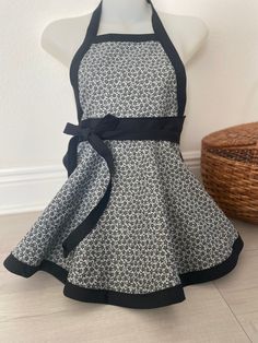 a white and black apron on a mannequin