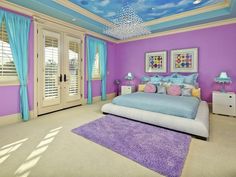 a bedroom with blue and purple walls, carpeted flooring and a sky painted ceiling