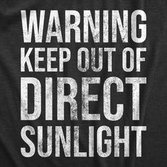 a black shirt that says warning keep out of direct sunlight