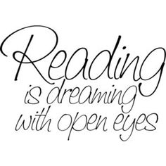 the words reading is dreaming with open eyes