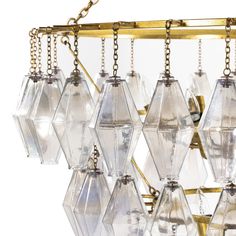 Transform any space into a glamorous Hollywood haven with our grand Luxe Waterfall Chandelier. The unique combination of iridescent glass and gold-leafed iron creates a stunning focal point. Customize the hanging length to fit your needs, with a minimum of 58.5". Add a touch of glam to your decor while elevating your space to new levels of luxury. Overall Dimensions: 39.00" W | 39.00" D | 54.00" H Luxury Cookware, Entry Console Table, Waterfall Chandelier, Waterfall Design, Drop Lights, Mirror Artwork, Round Chandelier, Living Room Bench, Furnishings Design