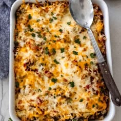 a casserole dish with cheese and vegetables