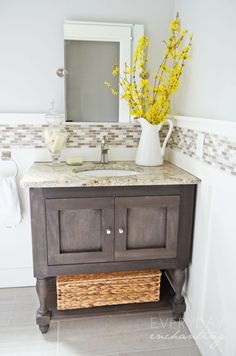 a bathroom sink with a basket underneath it