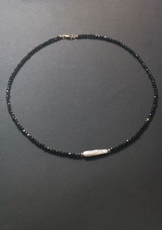 Super sparkly black spinel necklace with irregular pearl! 3mm faceted black spinel, super shine! 2 2mm 14k gold filled beads with one high luster stick shape pearl as the center piece. Total length around 17 to 17.5 inches. 14k gold filled clasp. Also available in 925 sterling silver (silver color). Black Bead Jewelry, Black Spinel Necklace, Spinel Necklace, Spinel Jewelry, Necklaces Black, Necklace Inspiration, Black Choker Necklace, Black Beaded Jewelry, Necklace Beads