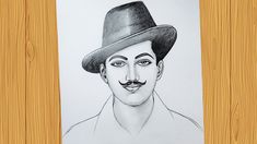 a drawing of a man with a mustache wearing a hat on a piece of paper