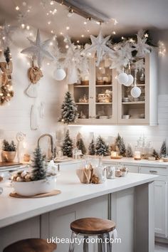 a kitchen decorated for christmas with lights and decorations